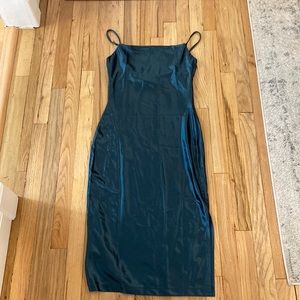 Sleeveless spaghetti strap satin cocktail dress.